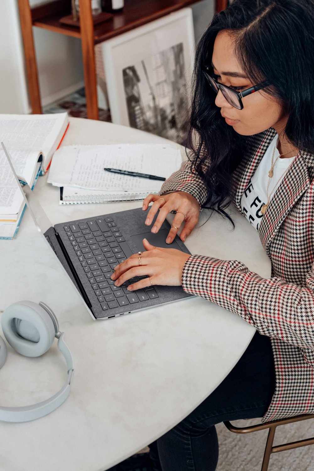 Woman writing on laptop