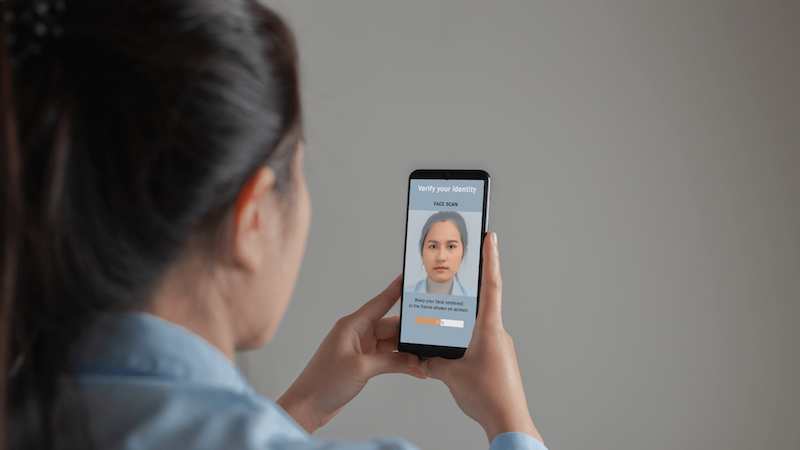 Woman verifying her identity with phone