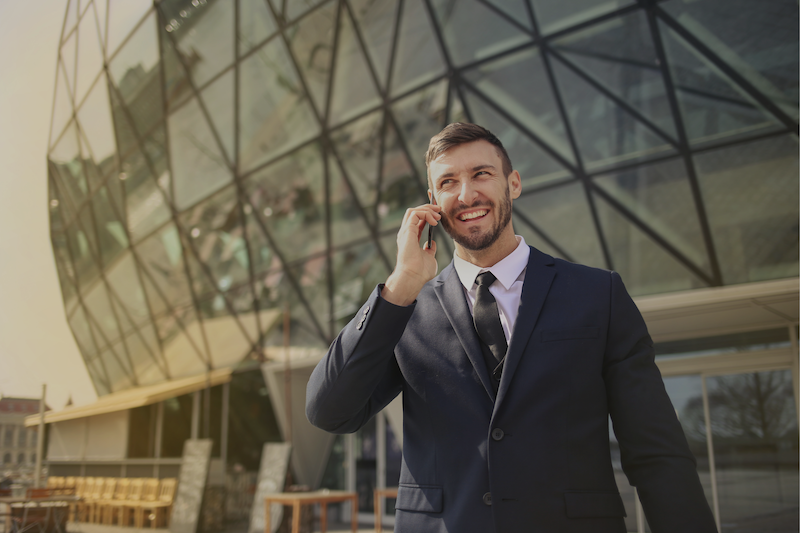 Man in suit talking on phone