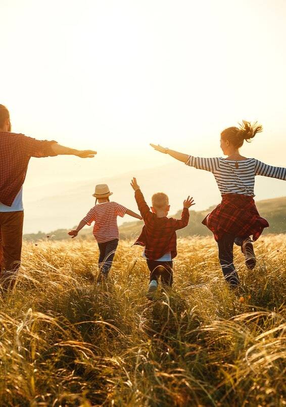 Family running on field