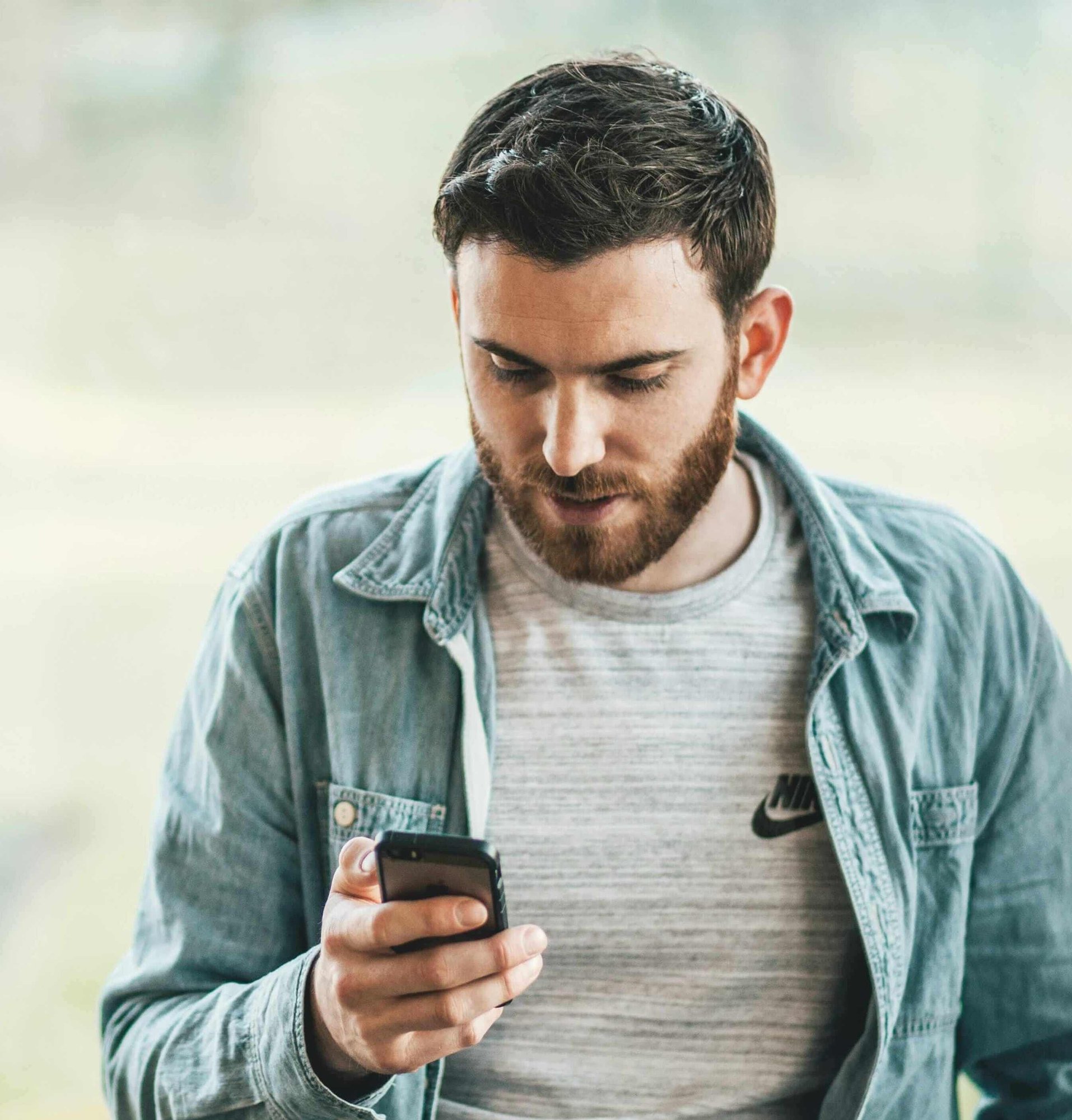 Man typing on phone